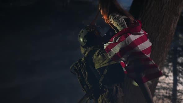 Returning Home Soldier Hugging with His Daughter and American Flag in Slow Motion