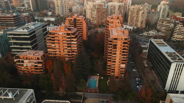 Aerial view of some buildings of Santiago city of Chile at golden hour. Rotating