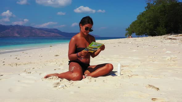 Modern happy ladies on vacation by the sea on beach on summer white sand and blue background 4K