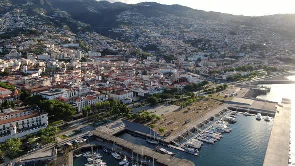 Flying over Funchal Marina and Praca do Povo on Madeira island in Portugal