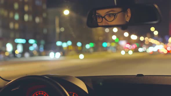 Asian woman driving car