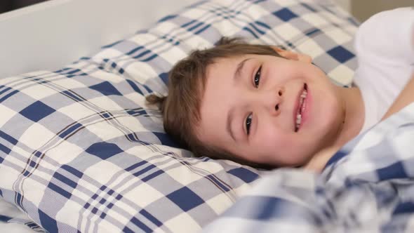 Child Was Lying on the Bed in a Good Mood the Child Recovered From the Illness and Felt Good