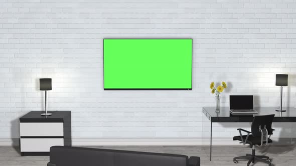A room inside the building with furniture and a green screen TV on the wall.