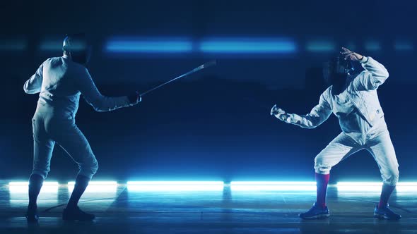 Two Sportsmen Are Having a Fencing Practice