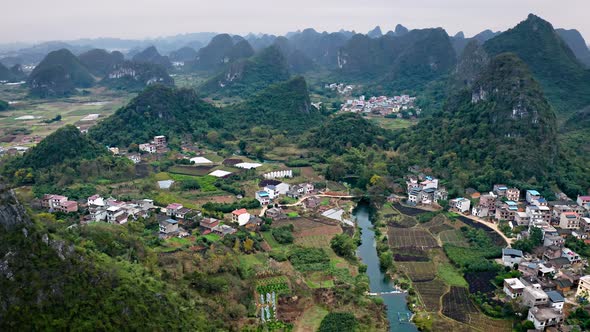 Aerial of the rock formations and towns along the Li River in China