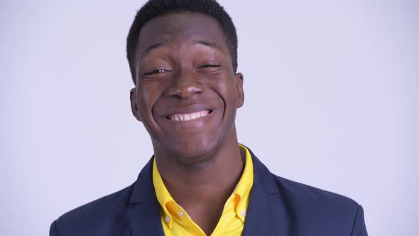 Face of Young Happy African Businessman in Suit Smiling