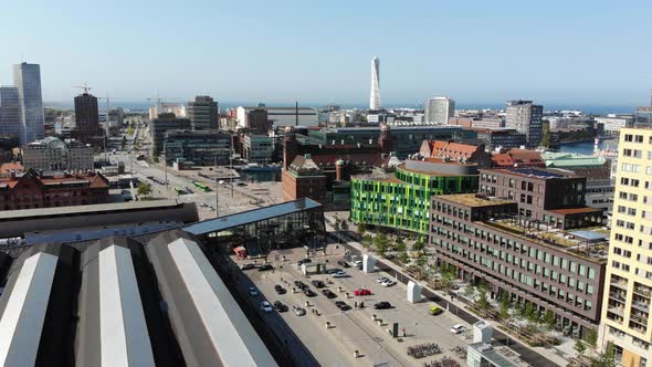 Drone flying over Malmö central station getting nice view of some known buildings