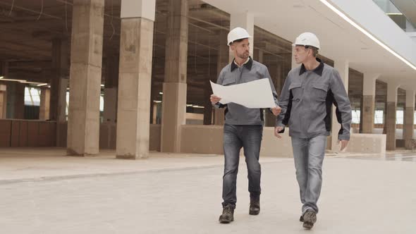 Two Builders Walking at Work