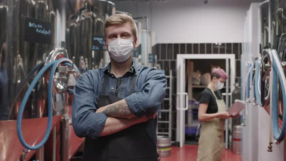 Portrait Of Brutal Brewery Worker In Mask