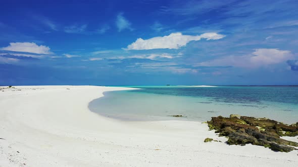 Beautiful overhead island view of a summer white paradise sand beach and aqua blue ocean background 