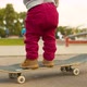 Legs of Funny Baby Standing on a Skate - VideoHive Item for Sale