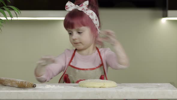 Cooking Pizza. Little Child in Apron Sprinkle the Dough with Flour in Kitchen