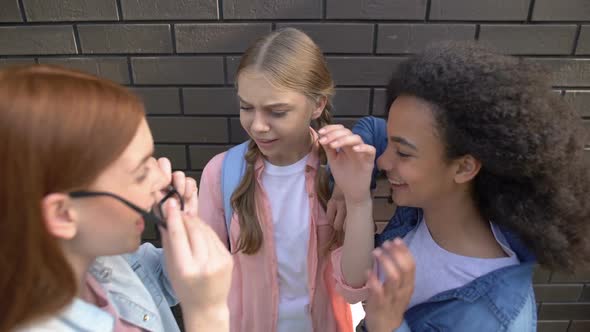 Teenagers Getting Schoolmate Eyeglasses, Mocking Female Pupil, Bullying Cruelty