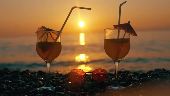 Summer Drinks on Sunset on Background of a Sea