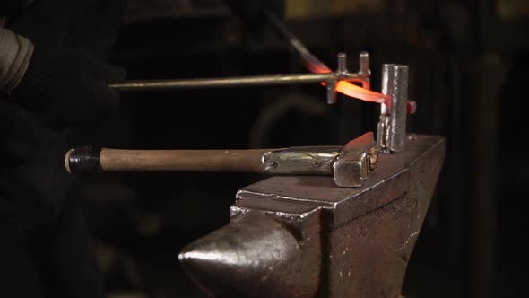 Close Up Shot of a Man's Hands, Who Is Engaged in Making Horseshoes for Animals