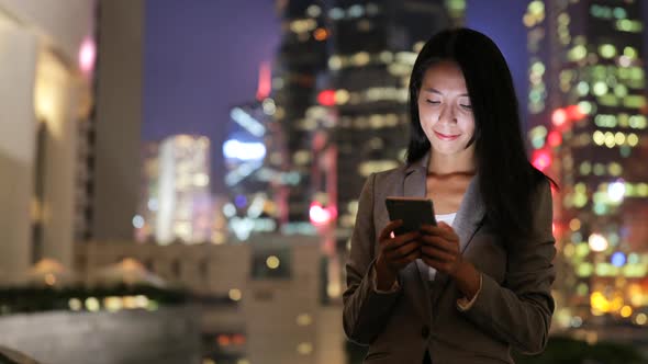 woman use of smart phone at night 