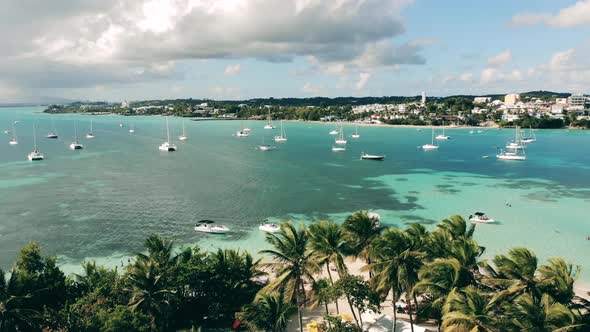 Tropical Coastline with Yachts in Sunny Weather