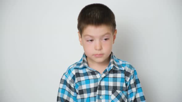 A 5Yearold Boy Nods His Head Raises His Eyebrows Up Moves His Eyes