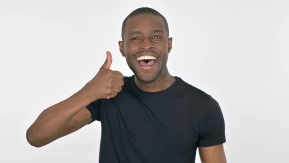 Thumbs Up By Young African Man on White Background