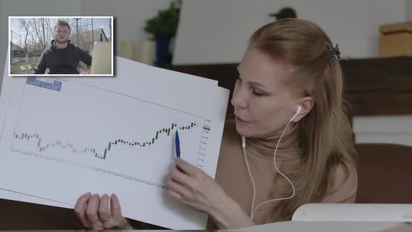 Blond Charming Woman Explaining Business Graphs To Young Handsome Man in Online Chat. Caucasian