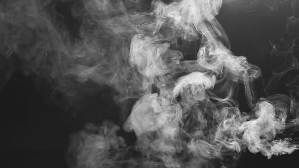 Vape Concept. Smoke Clouds and Vape Liquid on Dark Background