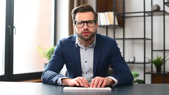 Successful Young Bearded Businessman with Laptop