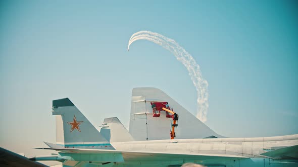 Reactive Planes Flying in the Sky and Performing the Show - an Airplane on the Foreground