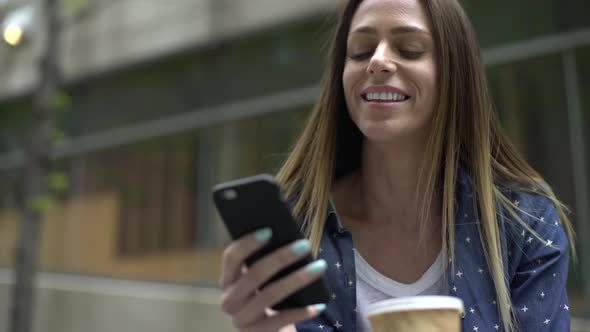 Woman texting on a smart phone