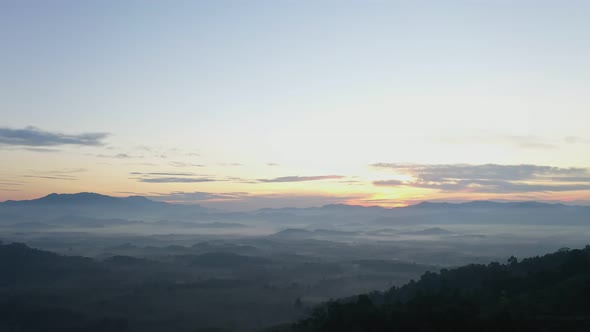 Aerial View Scenery Sunrise Fog Flowing Down To The Valley.