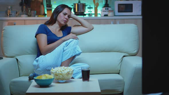 Tired Housewife Falling Asleep in Front of TV