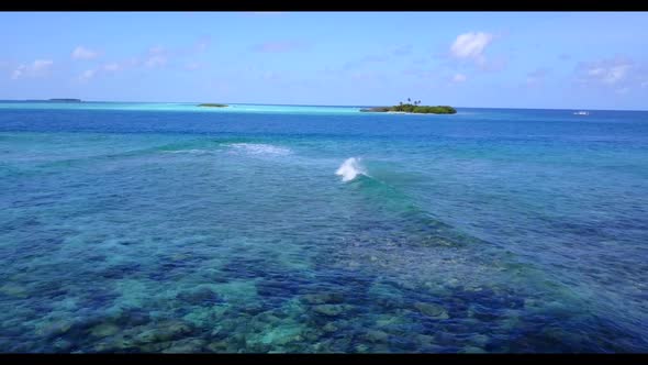 Aerial top view tourism of beautiful tourist beach journey by blue lagoon with white sandy backgroun