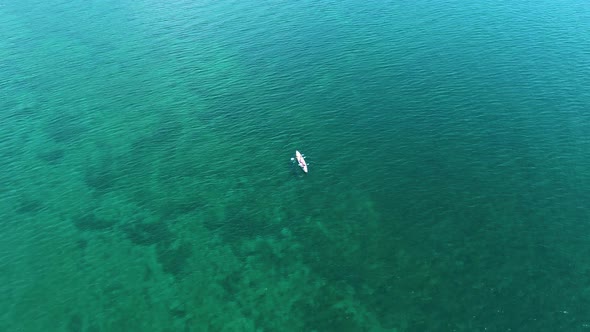 Aerial Footage of a White Boat on the Water of Lake