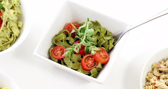 Bowls of various cooked pasta