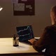 man works at a stock market through a laptop - VideoHive Item for Sale