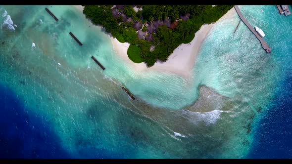 Aerial drone landscape of tropical lagoon beach break by blue sea with white sandy background of a d
