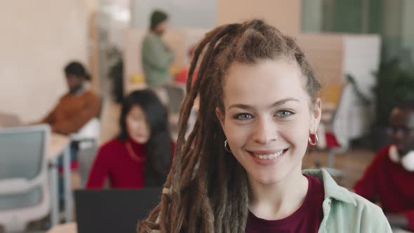 Portrait of Happy Businesswoman in Dreadlocks