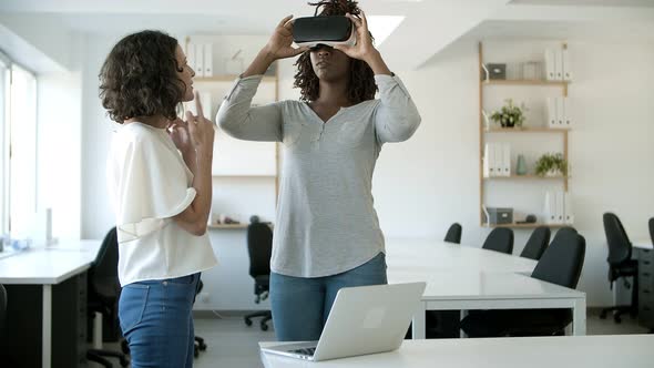 Cheerful African American Woman Wearing Virtual Reality Glasses.