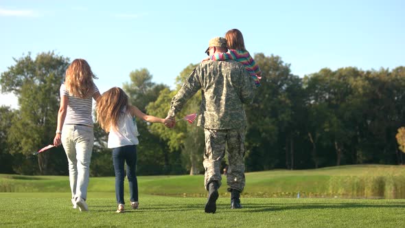 Soldier and His Family Going Toward the Lake.