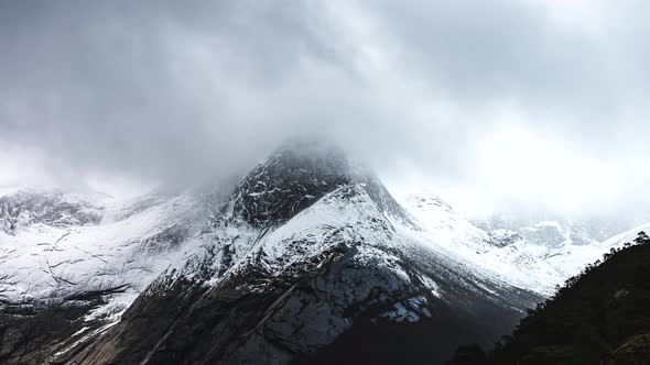 Distinctive snow-covered Stetind mountain, Norway; dramatic time lapse