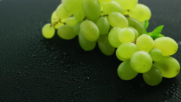 Green Grapes on Wet Table 