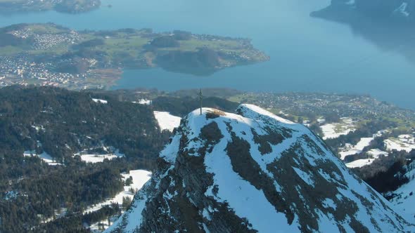 Cross on Top of Mountain and Lake Lucerne. Swiss Alps, Switzerland. Aerial View