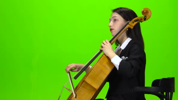 Girl Sits and Plays the Cello