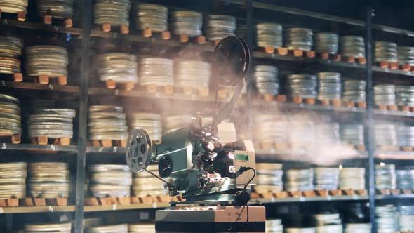 Film Archive with a Projector Working in Smoke