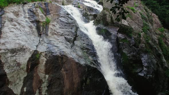 Drone flying backwards from Hin Lat Waterfall, Koh Samui, Thailand