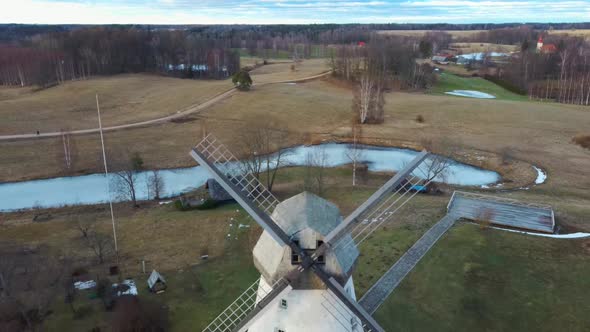 Old Araisi Windmill in Latvia Aerial Shot From Above. Winter Day at Sunrise 4K Video
