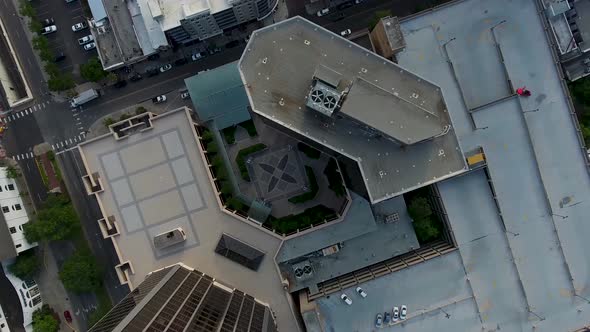 AERIAL: Birds eye view of downtown Mobile, Alabama with traffic and rooftops.