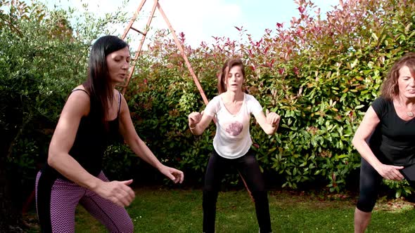 Four Women Exercising Outdoors