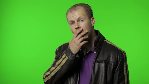 Rocker Man Looking with Amazement, Pointing Finger at Camera, Expressing Shock and Disbelief