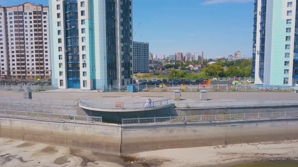 Newly Wedded Couple on Viewpoint Against City Aerial View