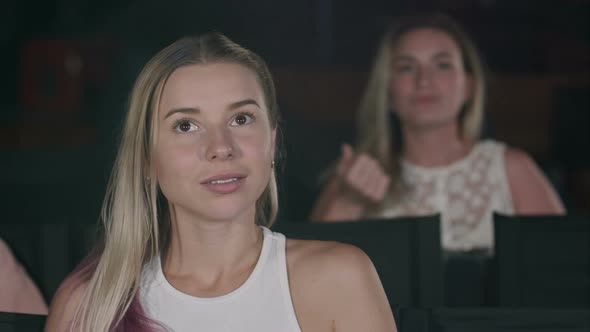 Young Woman Watch Film in the Cinema